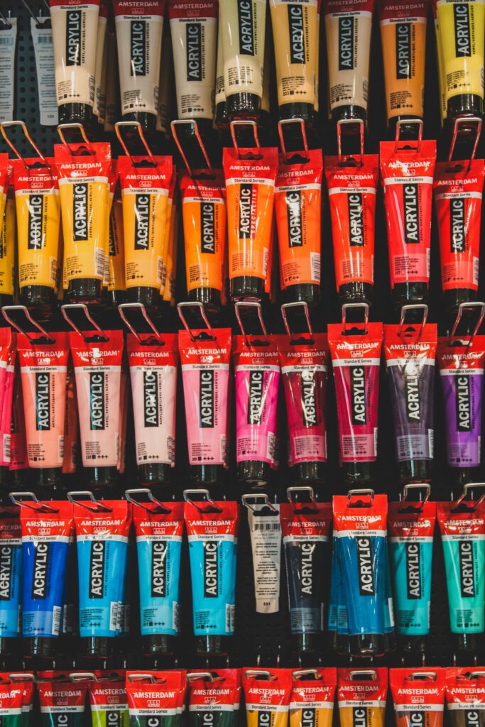 Acrylic paints displayed on store rack.