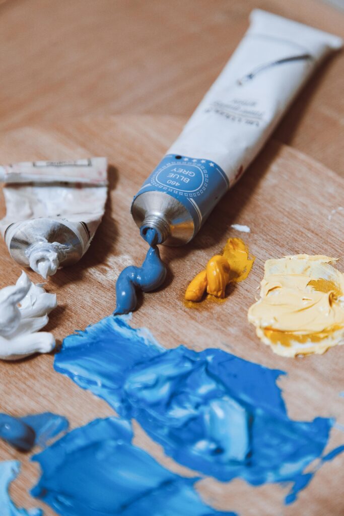 Paint squeezed out of oil paint tube onto palate.